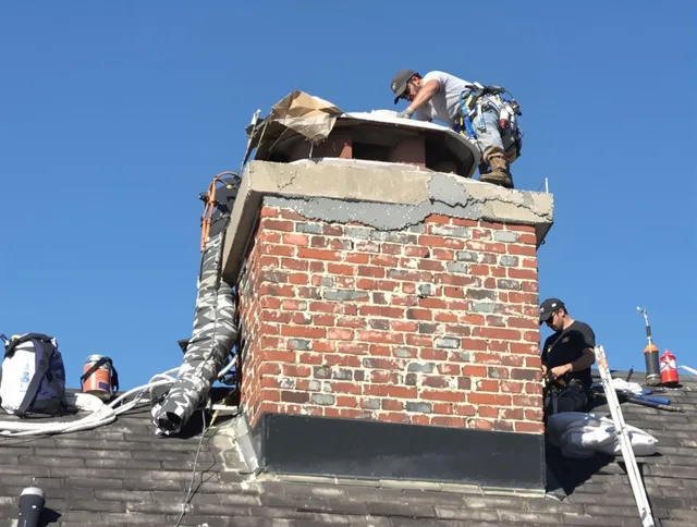 Shelton Chimney Sweep installing a custom chimney crown in Shelton, CT