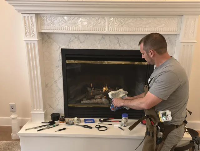 Shelton Chimney Sweep performing fireplace maintenance in Shelton, CT
